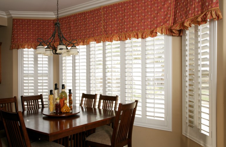 Wide kitchen windows with plantation shutters